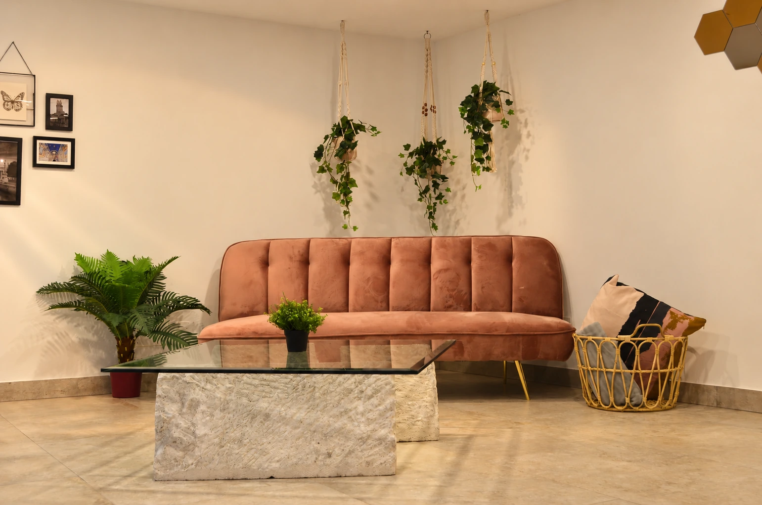 Completed warm lounge with pink sofa and glass coffee table