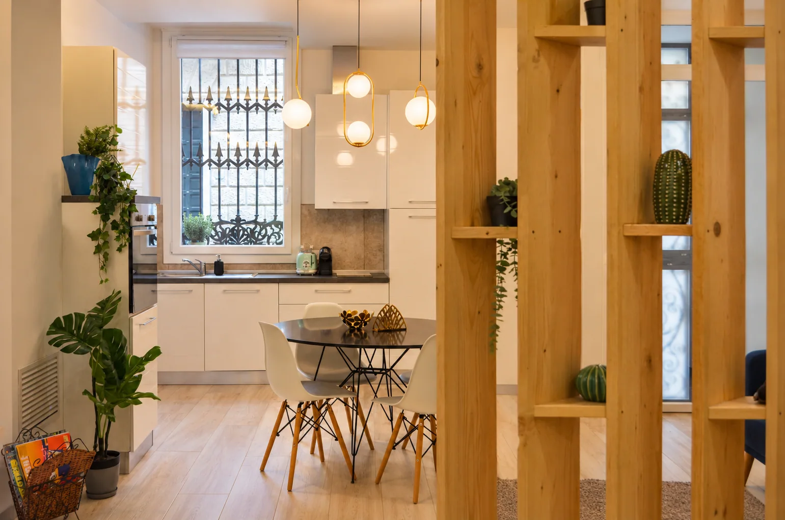 Kitchen and dining area with planted timber shelving